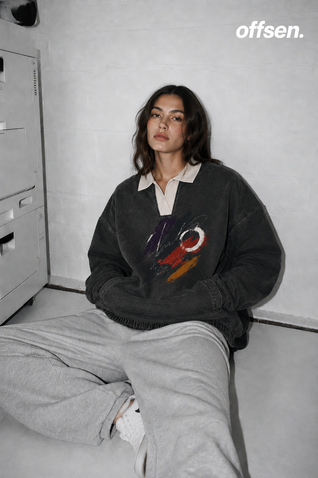 Model wearing the charcoal Imprint sweatshirt with a cream collar
