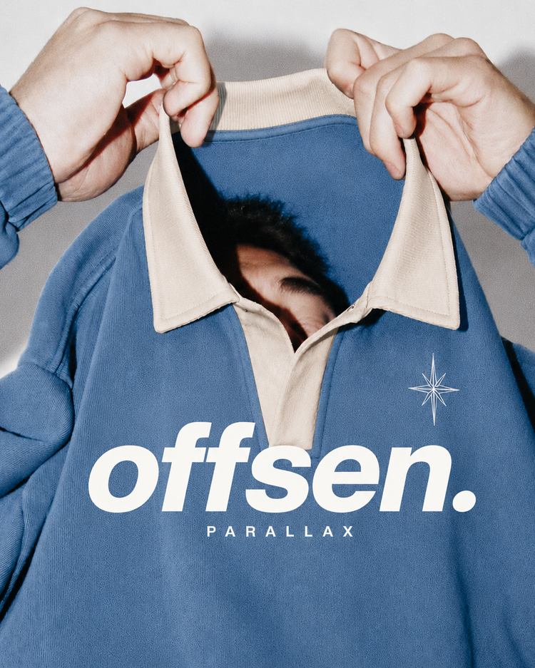 Model pulling the cream collar of the Parallax sweatshirt over their face